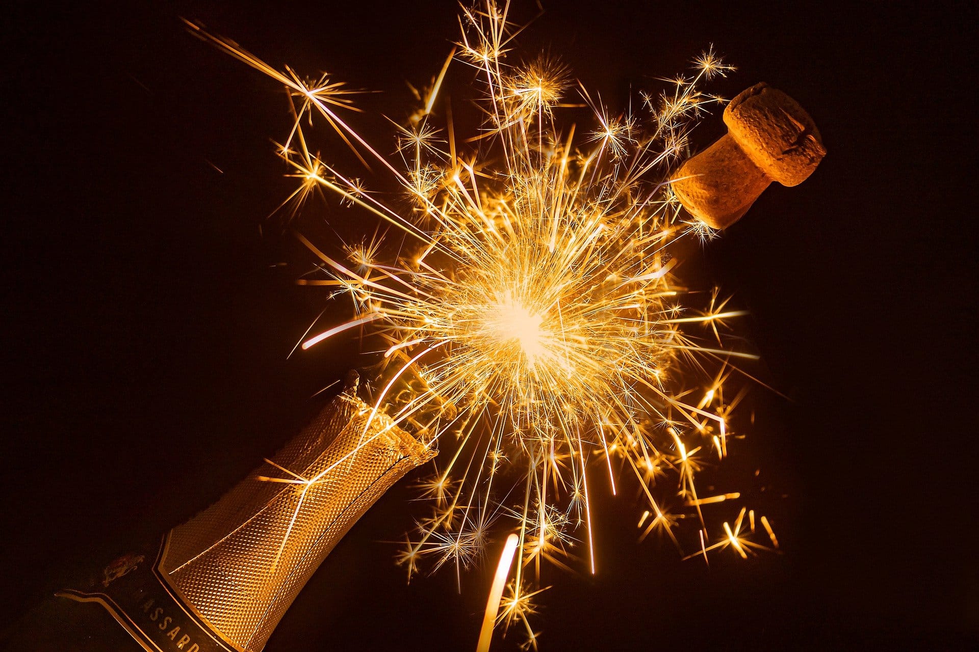 sparklers coming from a champagne bottle