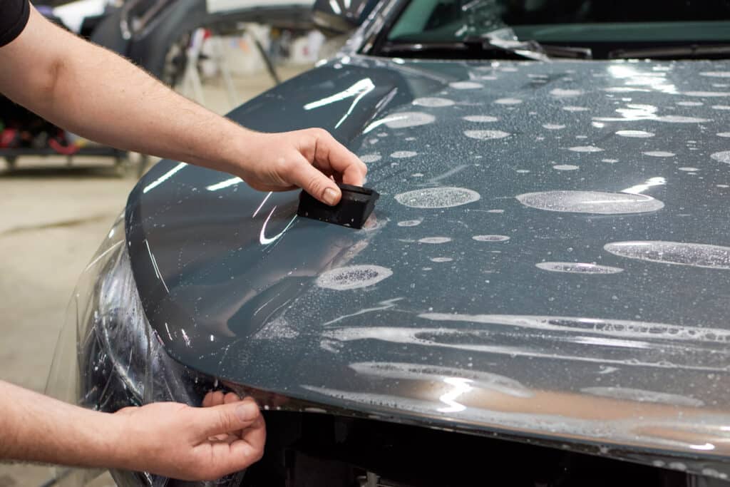 Man installing protective paint and varnish