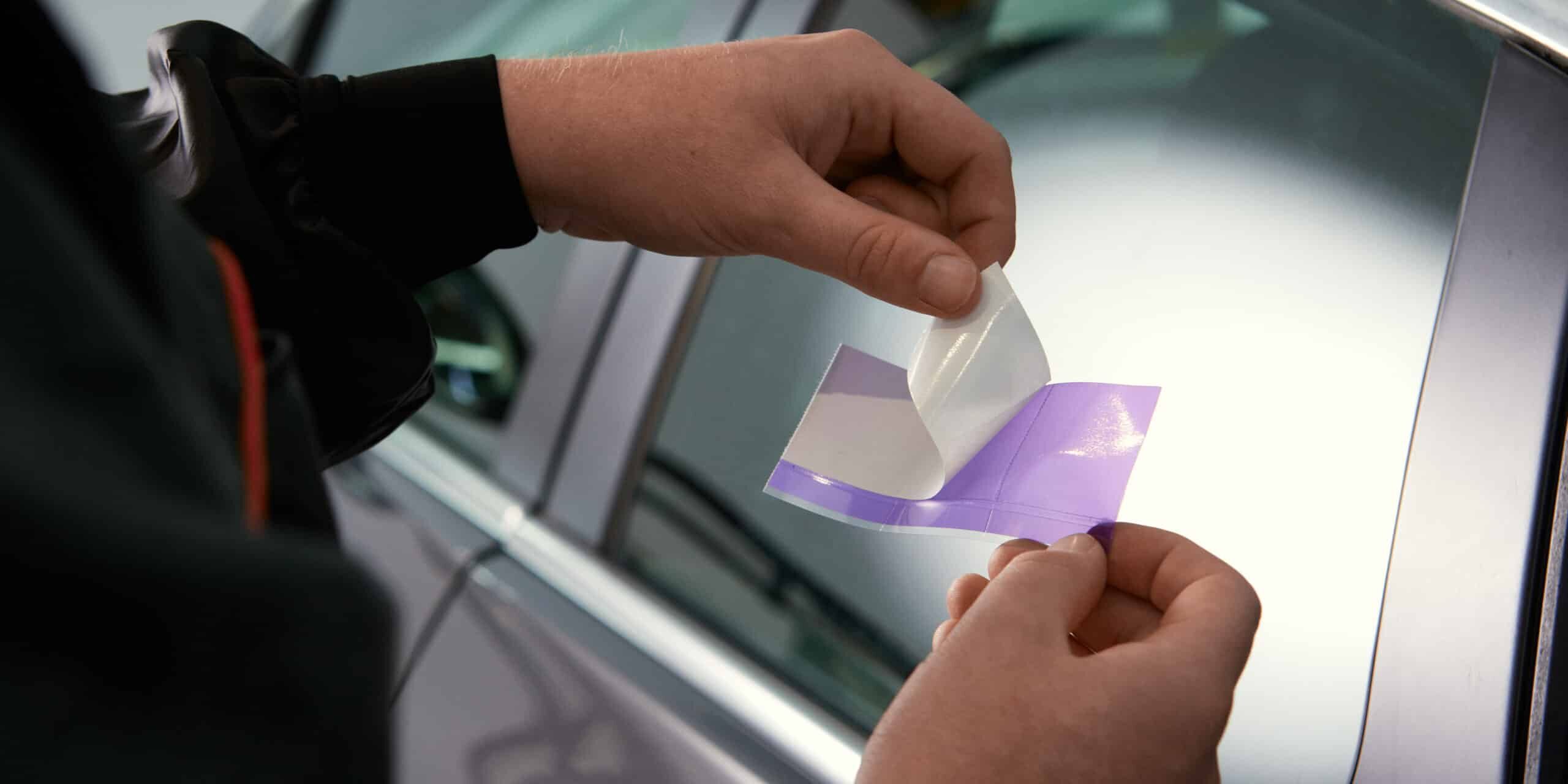 Mechanic using Perforated Plus Trim Lifting Tape