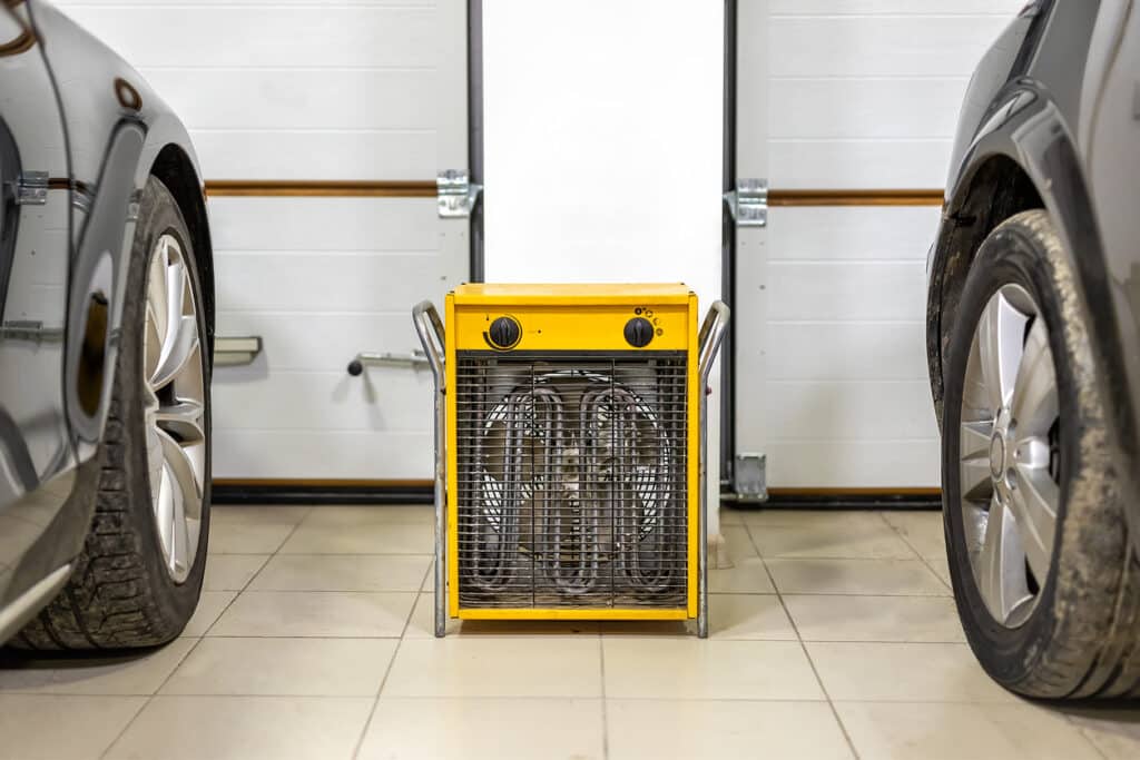 Yellow ventilation system sat on garage floor