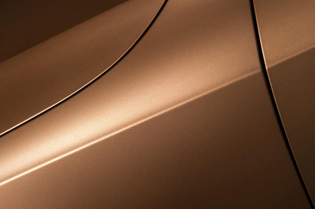 Zoomed in photo of a gold car door