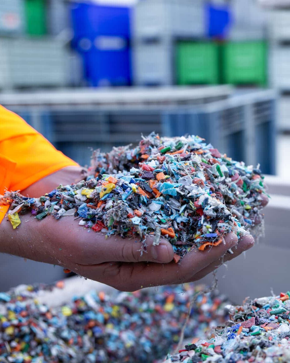 Plastic Resin pellets in holding hands.